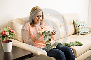 Senior adult woman doing some knitting