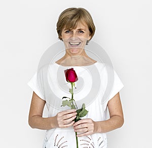 Senior Adult Woman Smiling Happiness Flower Studio Portrait