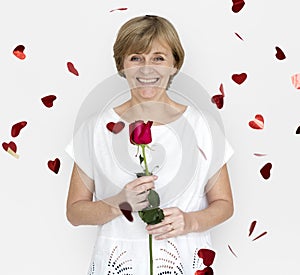 Senior Adult Woman Smiling Happiness Flower Studio Portrait