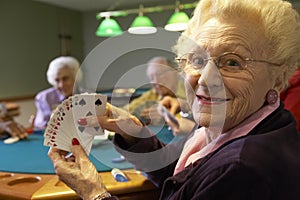 Senior adults playing bridge