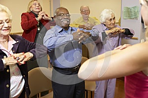 Senior adults in a stretching class photo