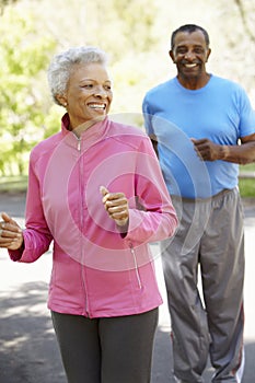 Senior African American Couple Jogging In Park