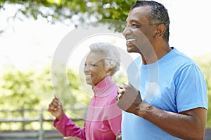 Senior African American Couple Jogging In Park