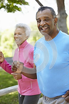 Senior African American Couple Jogging In Park