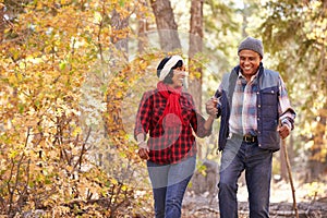 Senior African American Couple Walking Through Fall Woodland