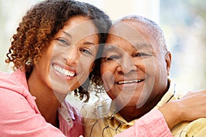 Senior African American man and granddaughter