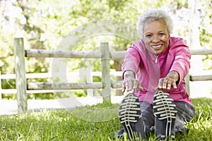 Senior African American Woman Exercising In Park