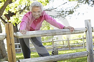 Senior African American Woman Exercising In Park