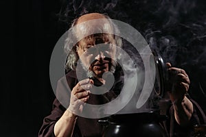 senior alchemist frowning near steaming pot