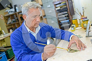 senior artisan at carpentry workshop