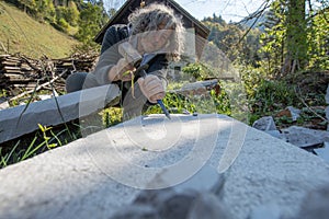 Senior artist working carving stone