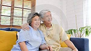 Senior asian couple in happy moment at home living room background, people emotional