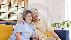 Senior asian couple in happy moment at home living room background, people emotional