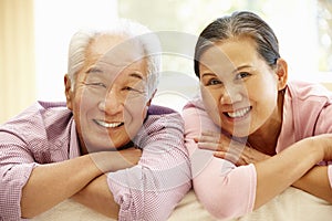 Senior Asian couple at home