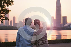 Senior asian couple looking sunrise