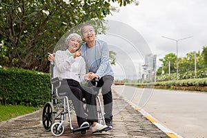 Senior Asian couple playing and teasing each other Happy family concept together outside the house