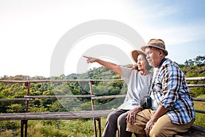 Senior Asian Couple, trekking and traveling to live happily in retirement