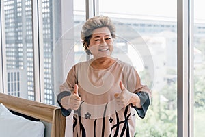 Senior Asian lady enjoying hospital services