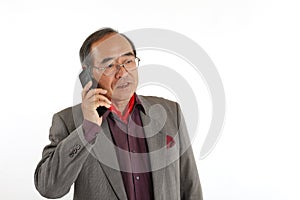 Senior Asian man making a phone call