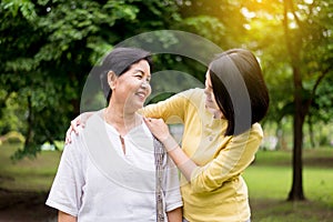 Senior asian older mother happy with hand daughter take care and support,Close up