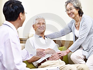 Senior asian patient being taken care of by family doctor and sp