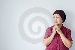 Senior asian woman with disease cancer standing on white background,Female felling depress and upset,chemotherapy