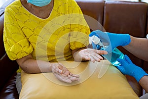 Senior Asian woman  in hospital with daughter taking care with protective face mask.  Health care and medicine concept