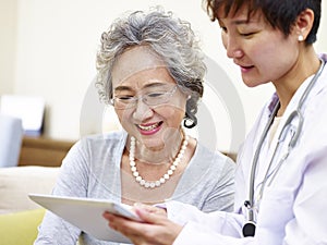 Senior asian woman seeing family doctor