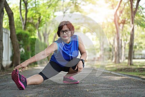 Senior asian woman stretch muscles at park