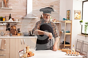Senior baker preparing bread