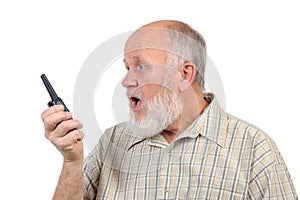 Senior bald man screaming to walkie-talkie