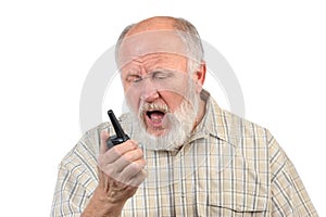 Senior bald man talking using walkie-talkie