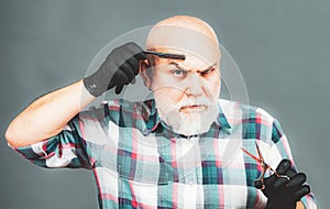 Senior barber. Bearded man, bearded male. Portrait of stylish barber man with white beard. Barber scissors and straight