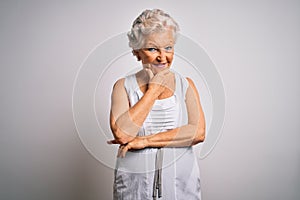 Senior beautiful grey-haired woman wearing casual summer dress over white background looking confident at the camera smiling with