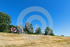 Senior biker with pet at the Dutch dike photo