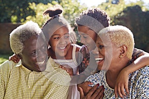 Senior black couple and grandchildren outdoors, close up