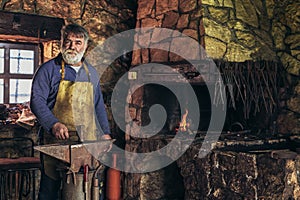 Senior blacksmith forge iron