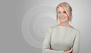 Senior blonde woman is smiling isolated