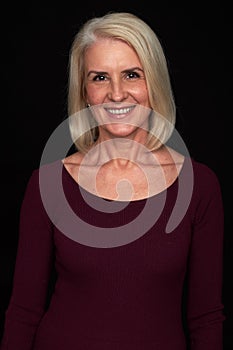 Senior blonde woman toothy smiling. isolated