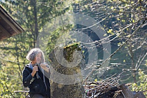 Bohemian artist carving in large piece of stone