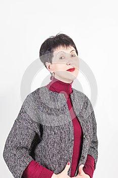 Senior buisness woman standing isolated on grey studio background