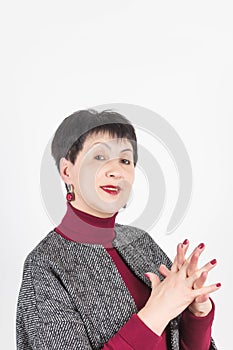 Senior buisness woman standing isolated on grey studio background photo
