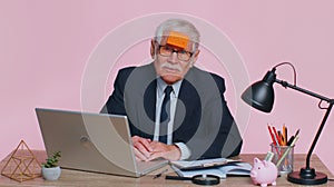 Senior business man analysing paperwork documents loses, bad fortune, loss, deadline problem trouble