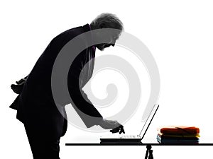 Senior business man computing typing silhouette