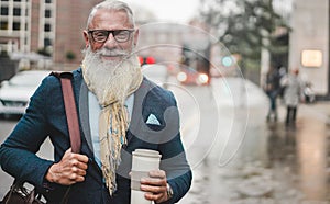 Senior business man going to work - Hipster entrepreneur drinking coffee while waiting bus - Job, leadership, fashion and
