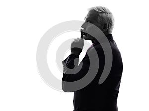 Senior business man hushing finger on lips silhouette