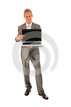 Senior business man pointing to laptop