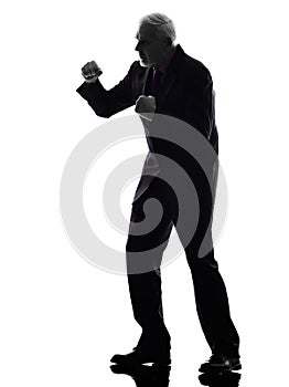 Senior business man punching the air silhouette