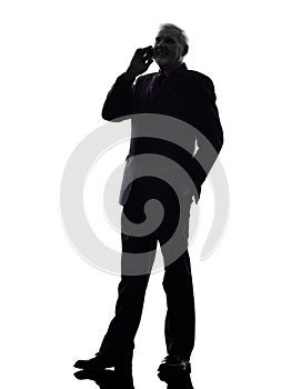 Senior business man on the telephone smiling silhouette