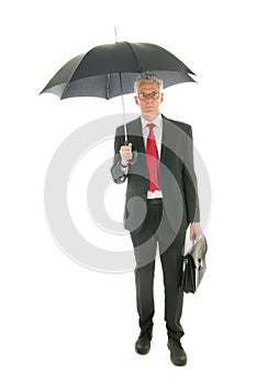 Senior business man with umbrella